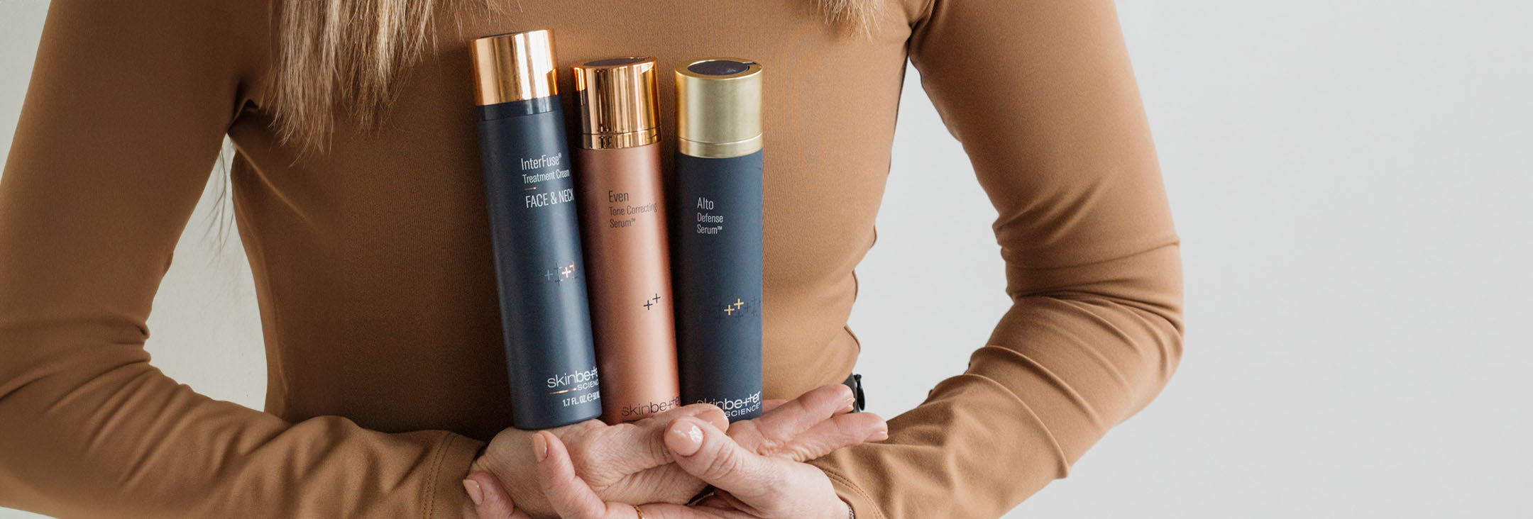 Amanda Brown holding Skinbetter Science products