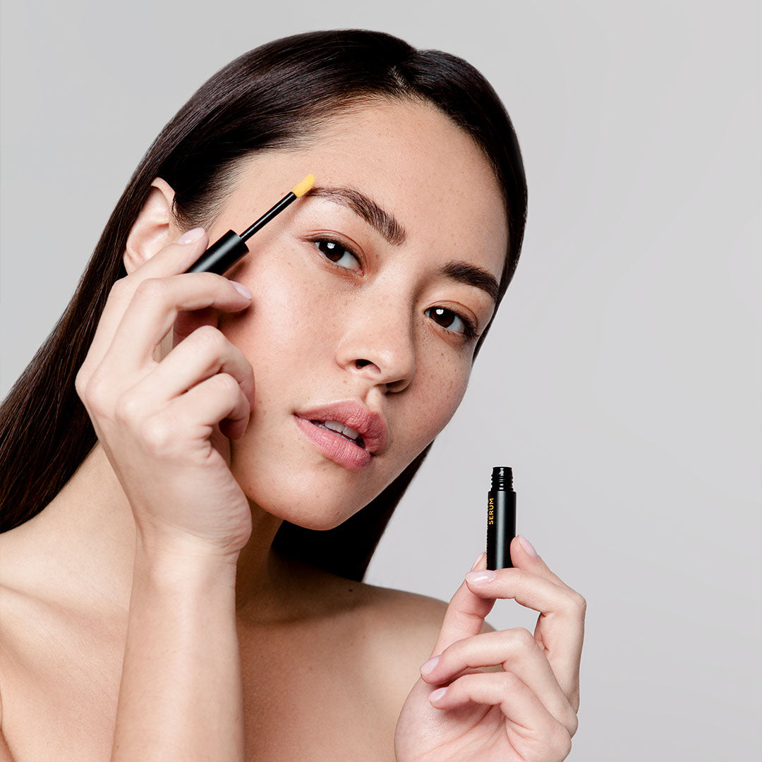 woman applying anteage Brow Serum