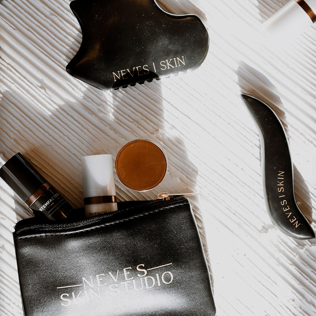Neves Skin Zipper Pouch open with products and gua sha