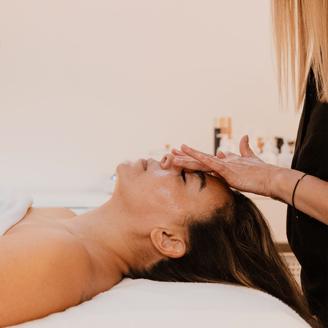 woman receiving facial massage